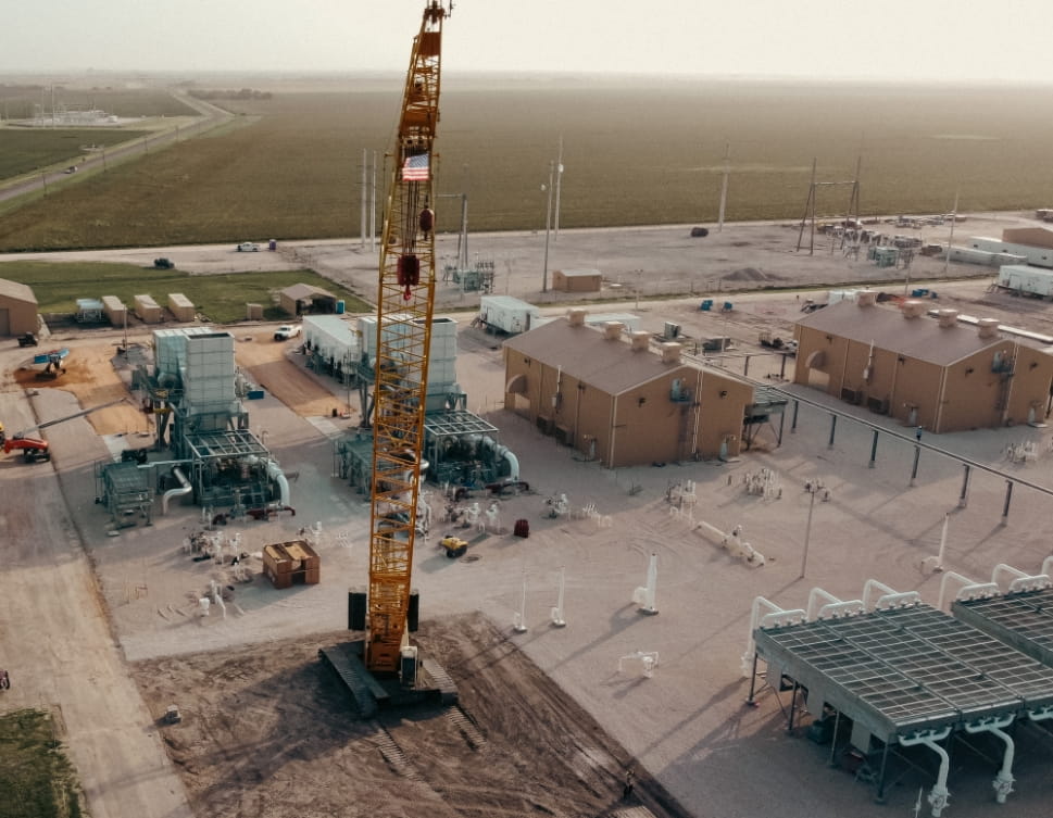 Crane flying an American flag at a Ranger construction site in Oklahoma
